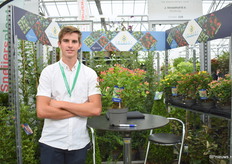 Roel Straathof of J. Straathof with the hypericum. They grow a lot of outdoor buxus and Ilex and in autumn hebe and these hypericums he is standing next to.